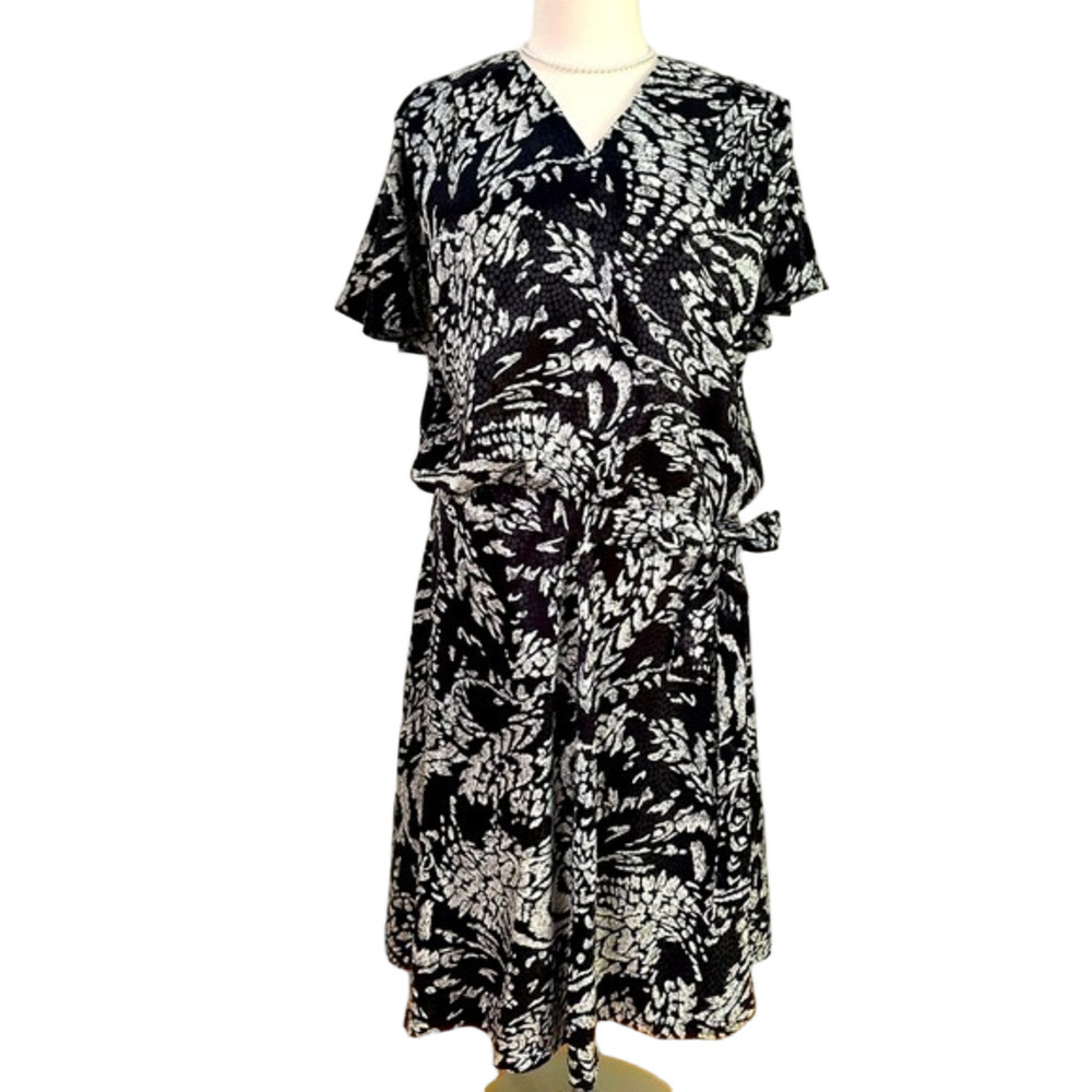 Beautifully tailored, 4 piece black and cream “batik”: 2 skirts and 2 tops
